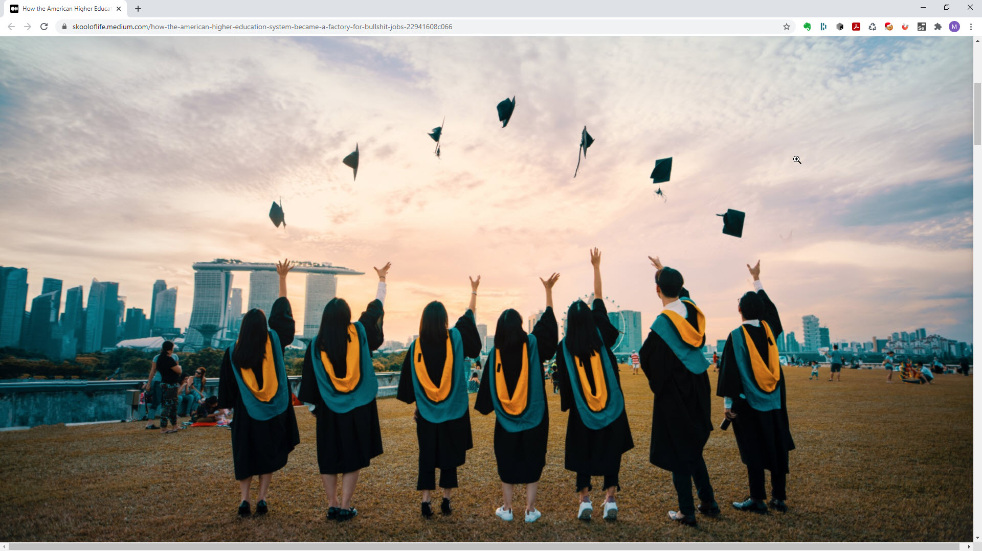 Students throwing their graduation caps in the air